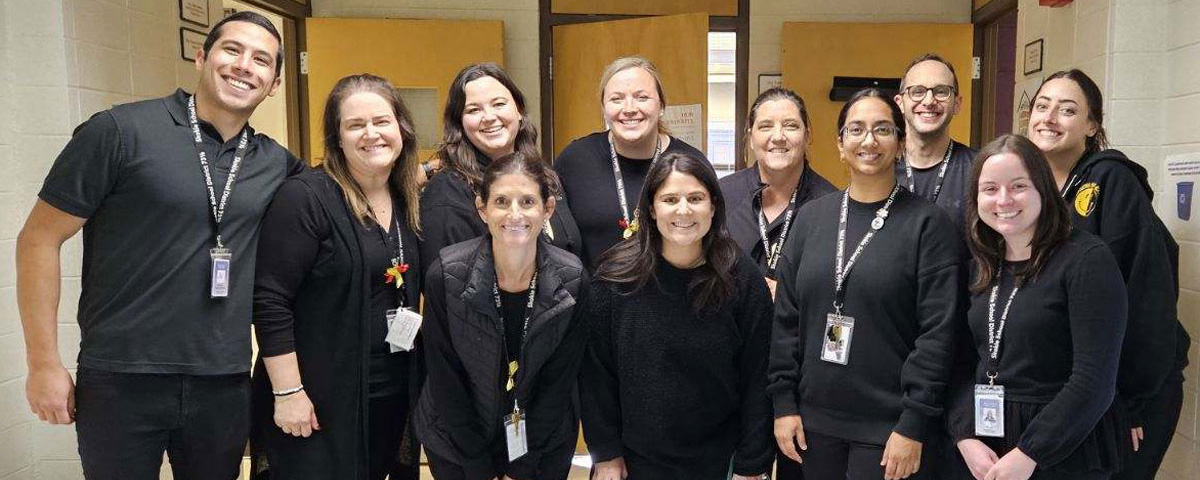 Photo of middle school teachers all dressed in black